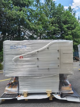 SC-5011 module secured with transparent stretch film and identified for shipment